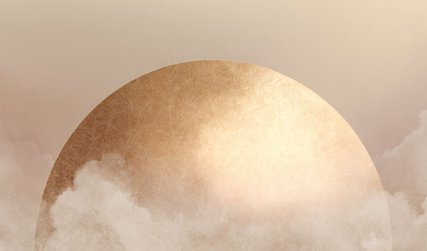 golden lunar globe setting onto cloudy horizon